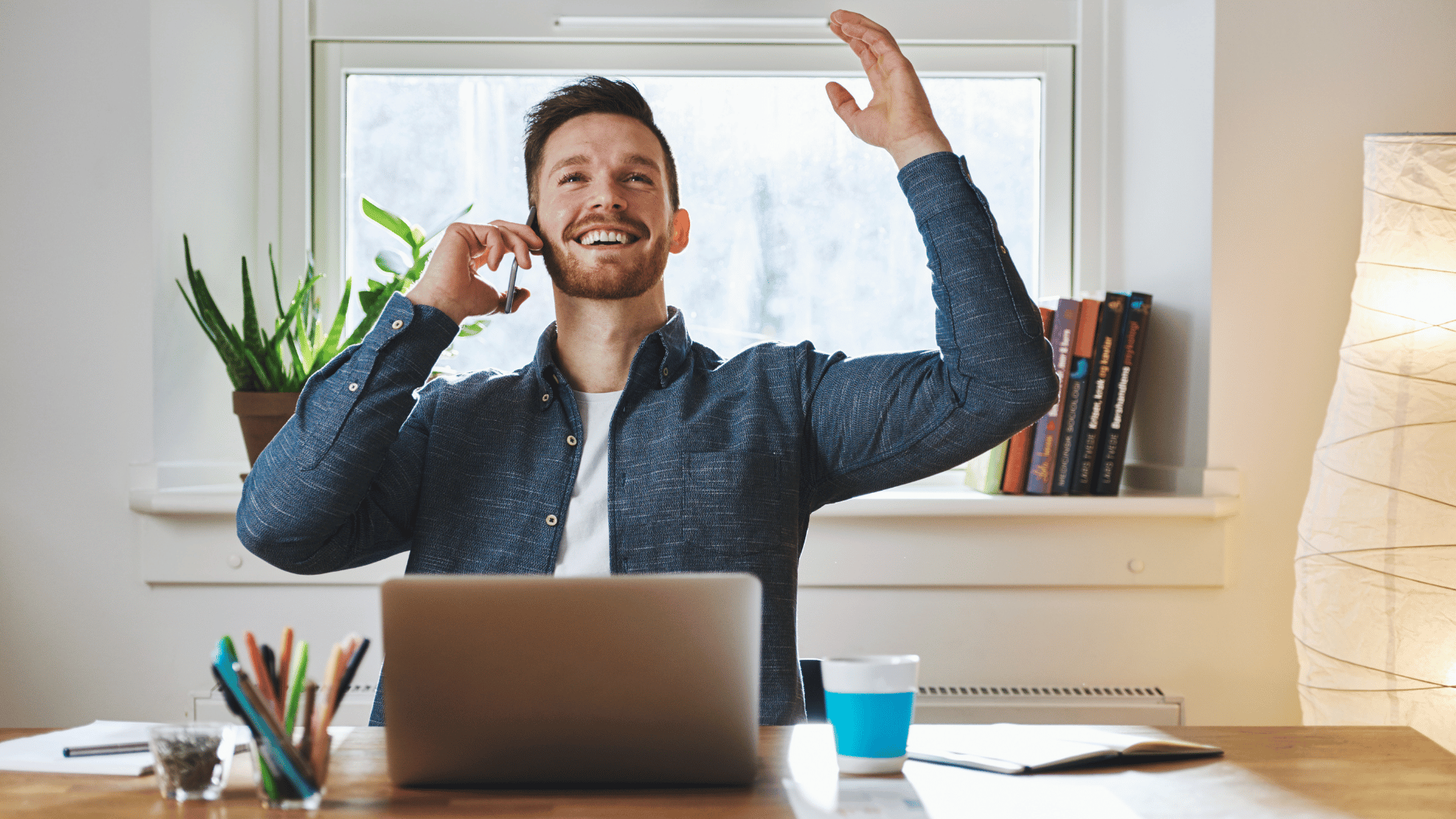 A man is excited on the phone to be on a call with The Entrepreneurial CPA to begin their voyage to entrepreneurial success. Let's Go To Grow!